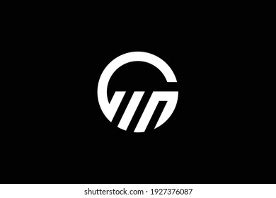 GM letter logo design on luxury background. MG monogram initials letter logo concept. MG elegant and Professional white color letter icon design on black background.