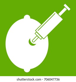 GMO lemon with syringe icon white isolated on green background. Vector illustration