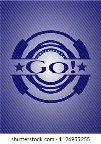 Go! emblem with jean background