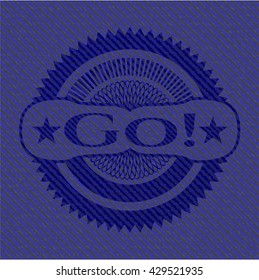 Go! emblem with jean background