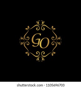 GO Initial logo. Ornament ampersand monogram golden logo black background