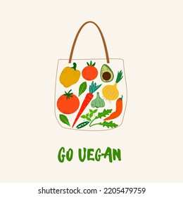 Go Vegan. Reusable grocery eco bag with vegetables isolated from white background. Zero Waste (Say no to plastic) and food concept. Vector