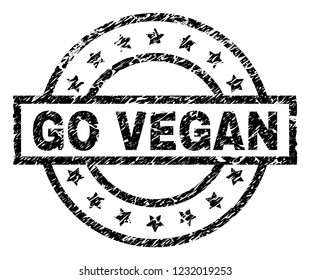 GO VEGAN stamp seal watermark with distress style. Designed with rectangle, circles and stars. Black vector rubber print of GO VEGAN title with corroded texture.