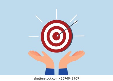 Goal, businessman hand hold target with arrow hit bullseye.