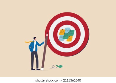 Goal setting, achievable target or purposeful objective, mission to accomplish or challenge to win for business success concept, businessman write down goal on notes and put on big dartboard target.