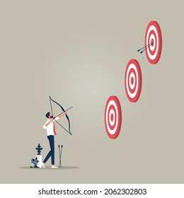 Goals and challenges, businessman holding bow and arrow aiming at targets of different heights held by his companion