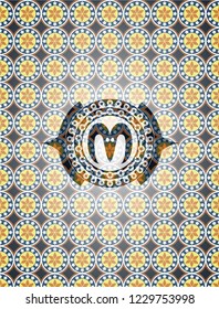 goat head icon inside arabesque style badge. arabic decoration.