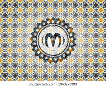 goat head icon inside arabic badge background. Arabesque decoration.