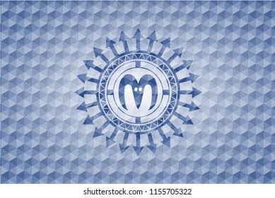 goat head icon inside blue polygonal badge.