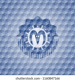 goat head icon inside blue emblem or badge with abstract geometric pattern background.