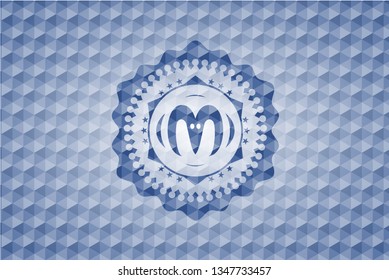 goat head icon inside blue hexagon badge.