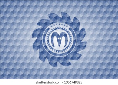 goat head icon inside blue emblem with geometric pattern background.