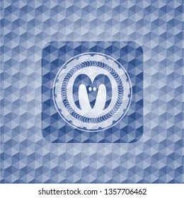 goat head icon inside blue hexagon emblem.