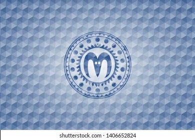 goat head icon inside blue emblem with geometric background.