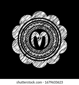 goat head icon inside chalk emblem written on a blackboard