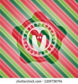 goat head icon inside christmas badge.
