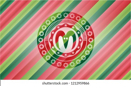 goat head icon inside christmas colors emblem.