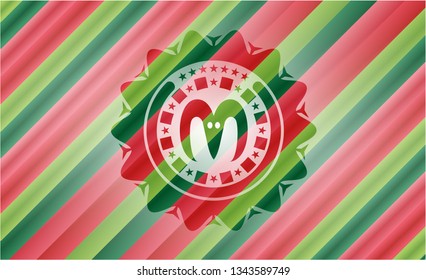goat head icon inside christmas style badge..