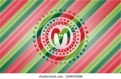 goat head icon inside christmas colors emblem.