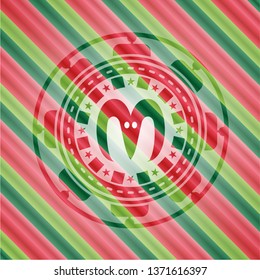 goat head icon inside christmas colors style emblem.