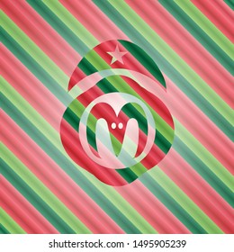 goat head icon inside christmas badge.