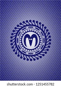 goat head icon inside denim background