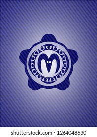 goat head icon inside emblem with jean background