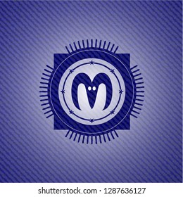 goat head icon inside jean or denim emblem or badge background