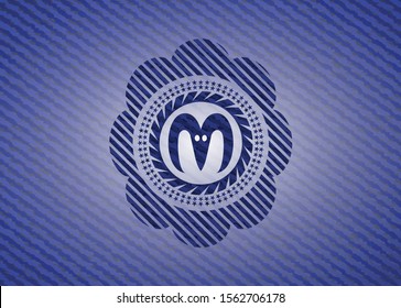 goat head icon inside jean background