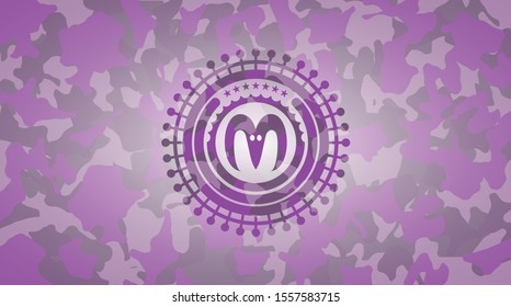goat head icon inside pink and purple camouflaged emblem