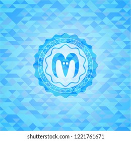 goat head icon inside realistic light blue emblem. Mosaic background