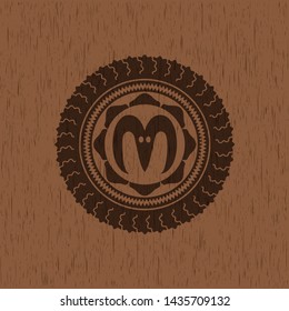 goat head icon inside realistic wooden emblem