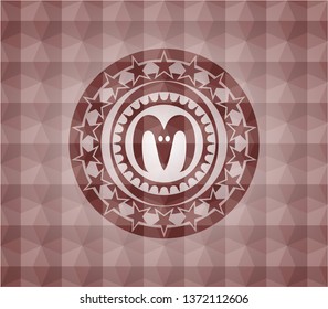 goat head icon inside red seamless badge with geometric pattern background.