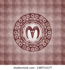 goat head icon inside red seamless emblem with geometric background.