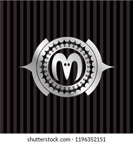 goat head icon inside silvery badge