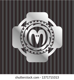 goat head icon inside silvery badge