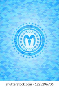 goat head icon inside sky blue emblem with mosaic ecological style background