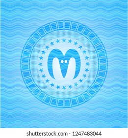 goat head icon inside sky blue water badge background.