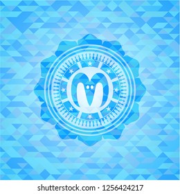 goat head icon inside sky blue emblem with mosaic background