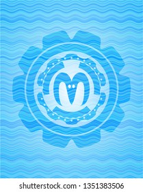 goat head icon inside water wave concept badge background.