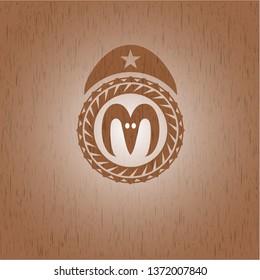 goat head icon inside wooden emblem