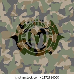 goat head icon on camo texture