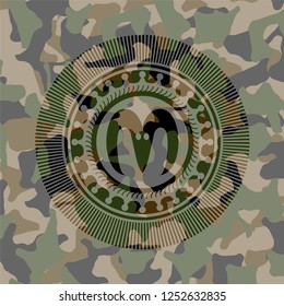 goat head icon on camo texture