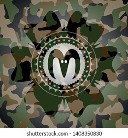 goat head icon on camo texture