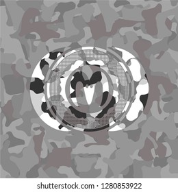 goat head icon on grey camo pattern