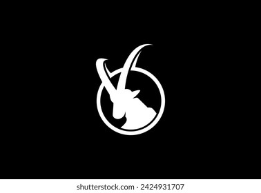 Goat head with long horns. Ibex logo design vector illustration