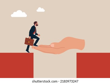 God hand reach to help or recuse entrepreneur cross the cliffs. Solve business problemHelping hand support in career development.