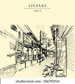 Gokarna village, India. Vector artistic drawing. Travel sketch. Men standing in a narrow street on Shivaratri day. Travel postcard, poster or coloring book page with Gokarna, India hand lettering