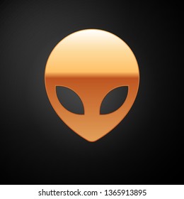 Gold Alien icon isolated on black background. Extraterrestrial alien face or head symbol. Vector Illustration