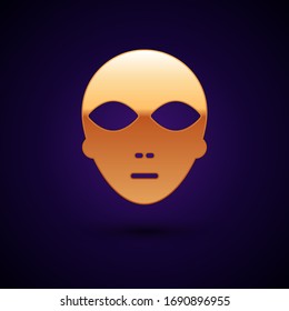 Gold Alien icon isolated on black background. Extraterrestrial alien face or head symbol.  Vector Illustration